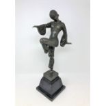 After D H Chiparus - A bronze dancing figure on marble stepped base, height 49 cm.