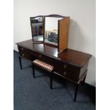 A Stag Minstrel dressing table with triple mirror and stool