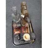 A tray of pottery figure of an Ottoman soldier, carved hardwood elephants, wooden candlesticks,