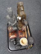 A tray of pottery figure of an Ottoman soldier, carved hardwood elephants, wooden candlesticks,