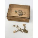 A trinket box of 9ct gold jewellery, gold plated charm,