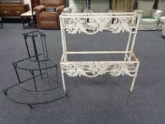 A wrought iron two tier plant trough and a metal corner plant stand