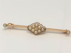 A yellow metal (tests 15ct gold) pearl and diamond brooch, 3.52g.