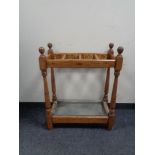 An early twentieth century oak stick stand