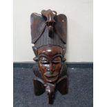 A large carved hardwood tribal mask