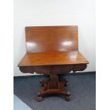 A Victorian mahogany pedestal turnover top table