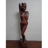 Carved hardwood Polynesian figure of a female nude