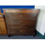 A late 19th century oak and walnut five drawer chest