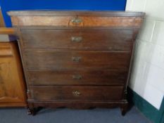 A late 19th century oak and walnut five drawer chest