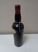 A vintage bottle of port, no label, cap labelled Corney & Barrow,