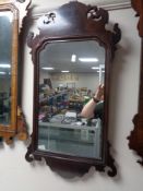 A Victorian mahogany Chippendale style wall mirror.