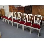 A set of eight painted dining chairs