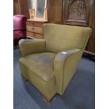 An Edwardian button back armchair