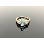 A 10ct gold topaz and diamond ring,