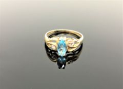 A 10ct gold topaz and diamond ring,