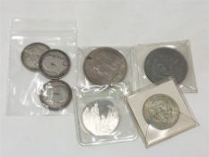 A Victorian crown 1889, US 1 dollar and half dollar coins,