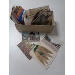 A box of 20th century colour and monochrome postcards,