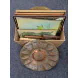 A box of assorted pictures and a embossed brass and copper wall plaque
