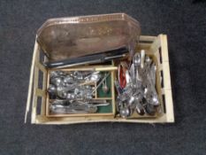 A box of stainless steel cutlery, kitchen knives,