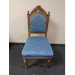 An Edwardian oak hall chair