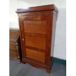 An antique mahogany hall cupboard