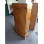 A 20th century walnut single door cabinet