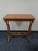 An antique inlaid mahogany occasional table