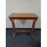 An antique inlaid mahogany occasional table