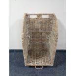 A wicker log trolley