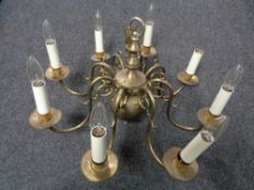 A continental brass eight branch chandelier