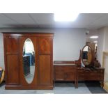 A three piece late Victorian inlaid mahogany bedroom suite