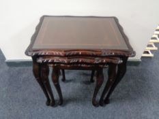 A nest of three inlaid mahogany tables