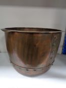 An antique copper planter