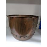 An antique copper planter