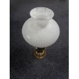 A brass Duplex oil lamp with opaque glass shade and chimney.