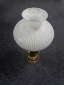 A brass Duplex oil lamp with opaque glass shade and chimney.