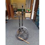 An ebonised spinning wheel
