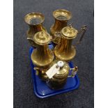 Tray of three brass teapots and a pair of brass and embossed vases