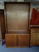 A set of mid 20th century walnut open shelves