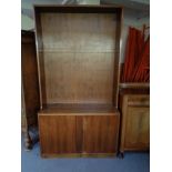 A set of mid 20th century walnut open shelves