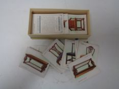 A Wills cigarette card albums with cigarettes and a box of Wills Old Furniture cigarette cards