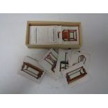 A Wills cigarette card albums with cigarettes and a box of Wills Old Furniture cigarette cards