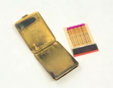 A 9ct gold match holder, the hinged lid engraved "W.S.R" and the inside engraved "13.12.33 From M.C.