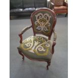 A stained beech framed salon armchair