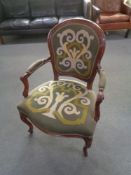 A stained beech framed salon armchair