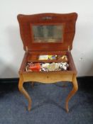 A late 19th century continental inlaid kingwood work table on cabriole legs