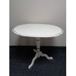 An early 20th century painted occasional table