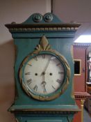 An antique continental painted longcase clock with pendulum and weights