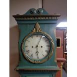 An antique continental painted longcase clock with pendulum and weights