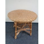 A circular wicker conservatory table